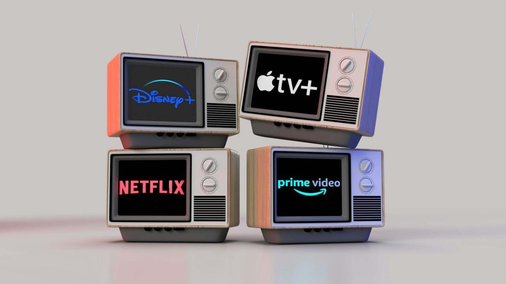 Four vintage televisions display the logos of popular streaming services: Disney+, Apple TV+, Netflix, and Prime Video.